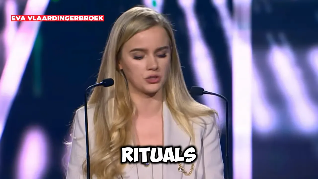 EVA VLAARDINGERBROEK speaking at a podium with the on-screen text “RITUALS.”