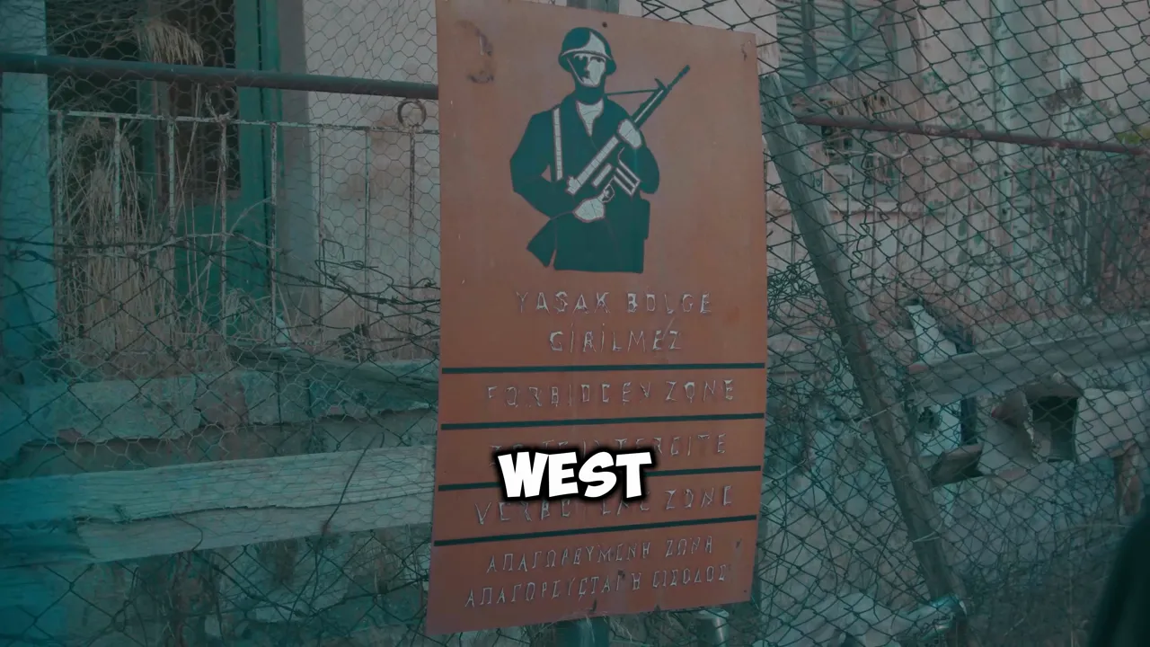 Rust-coloured sign reading 'Forbidden Zone' mounted on a fence marking a buffer area
