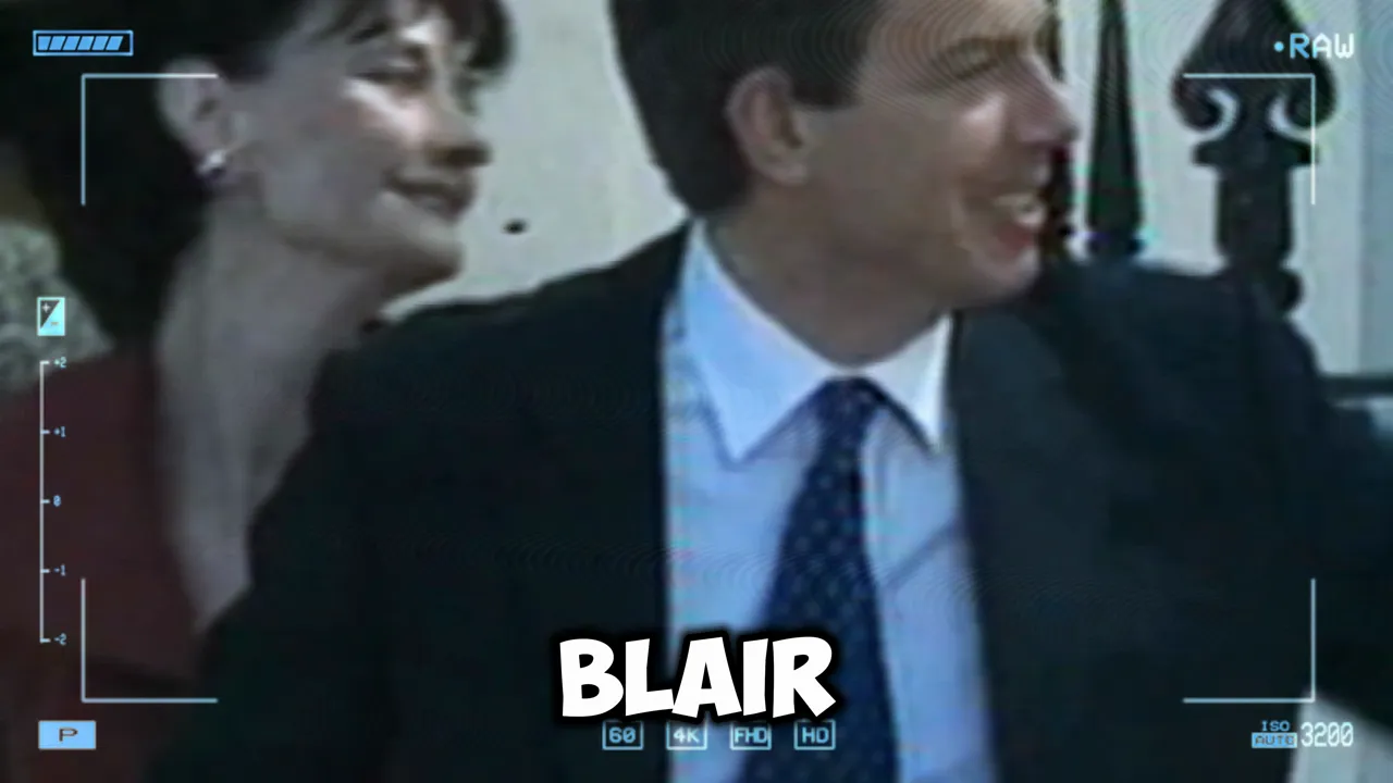 Grainy archive-style footage of a 1990s-era politician at an event with on-screen name overlay