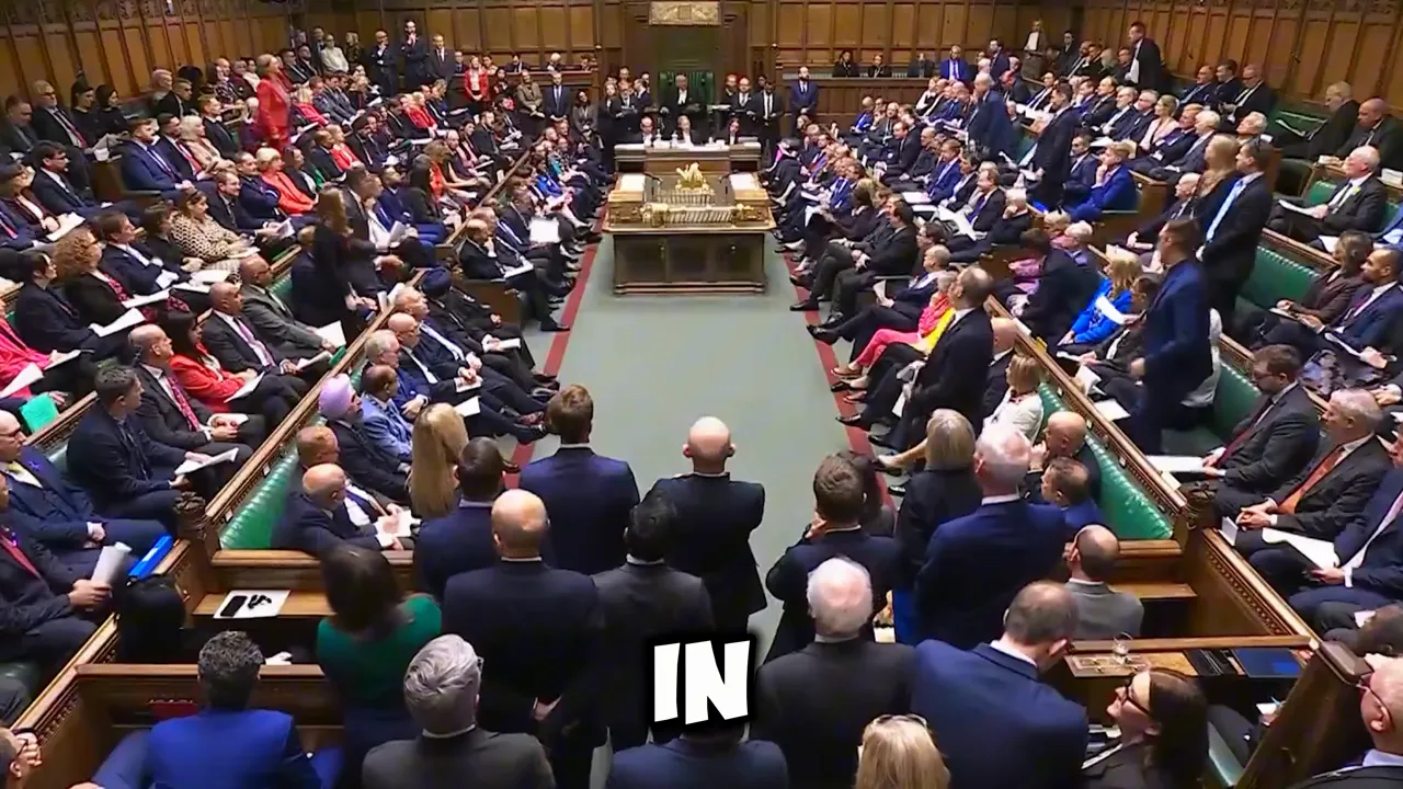 UK House of Commons chamber filled with MPs during a parliamentary session, viewed from the back
