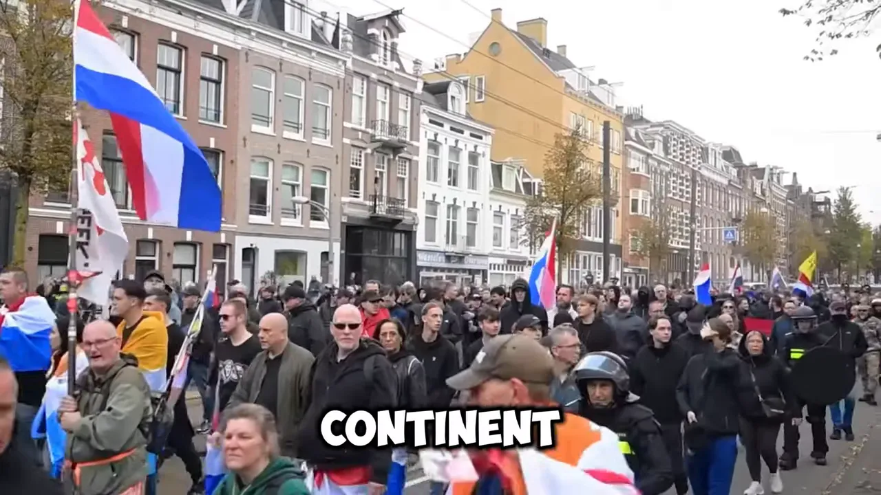 Crowd marching in a European city with flags and banners during a political demonstration