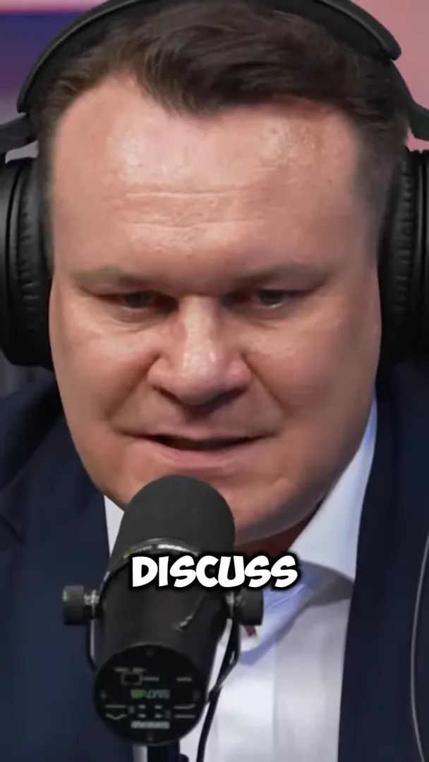 Dominik Tarczyński speaking into a microphone with emphasis