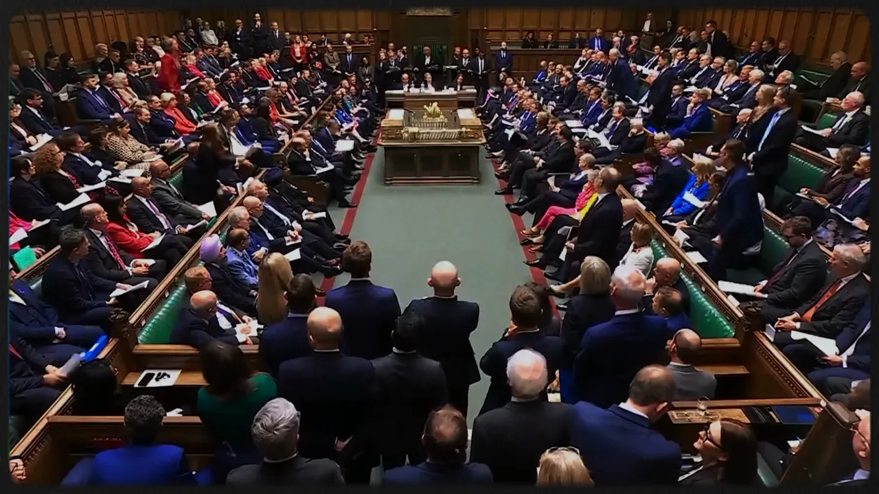 Packed parliamentary chamber during a seated debate with members facing each other