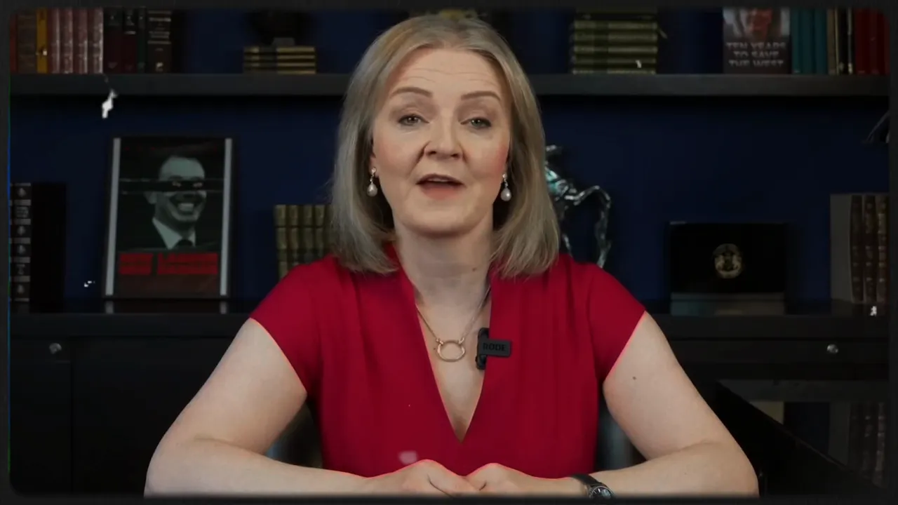 Person speaking to camera in an office setting with bookshelves behind.