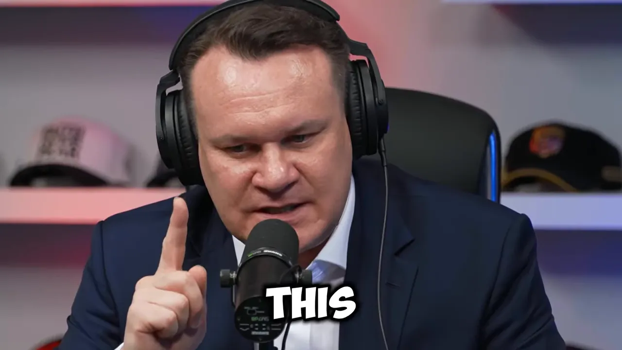 Dominik Tarczyński pointing while speaking into a studio microphone with on-screen text reading “THIS”
