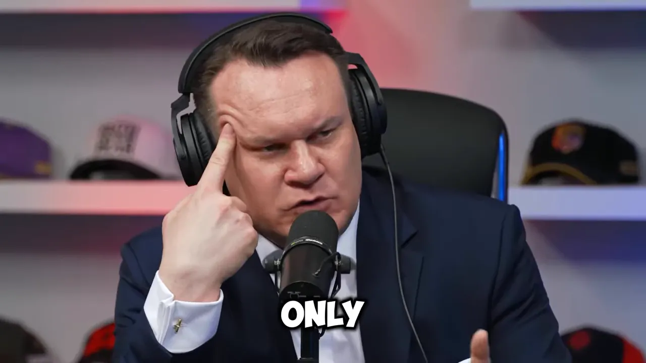 Dominik Tarczyński wearing over-ear headphones speaking into a studio microphone with on-screen text 'ONLY'