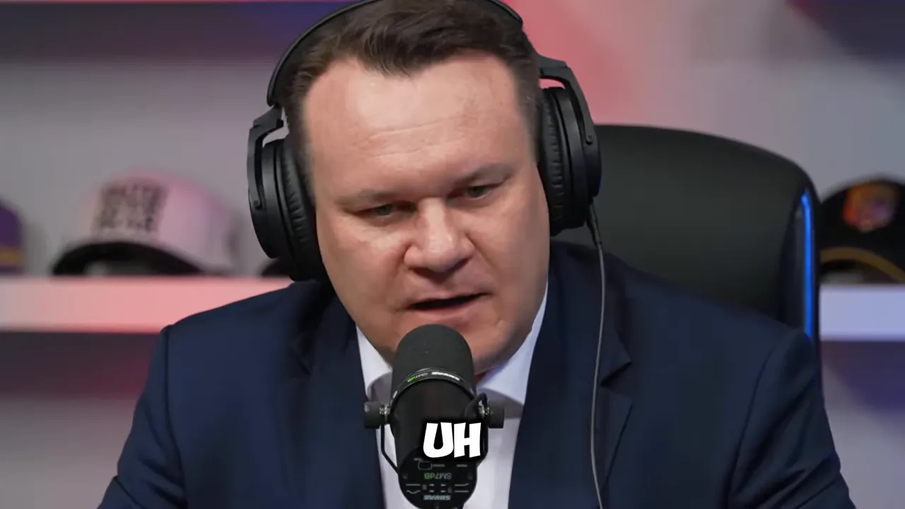 Dominik Tarczyński speaking into a microphone with headphones