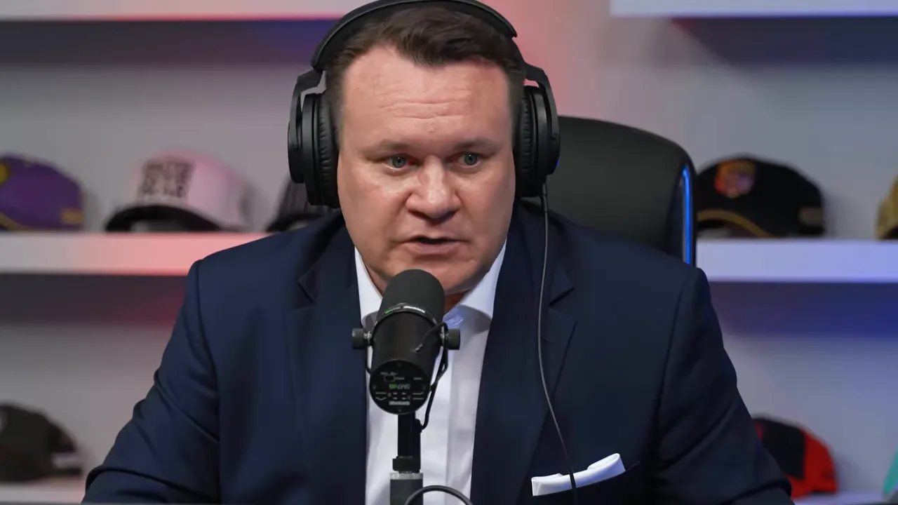 Dominik Tarczyński speaking into a studio microphone with headphones, no on-screen emphasis text