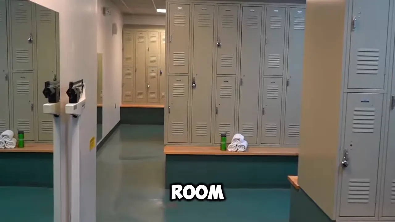 Empty changing room with lockers and benches