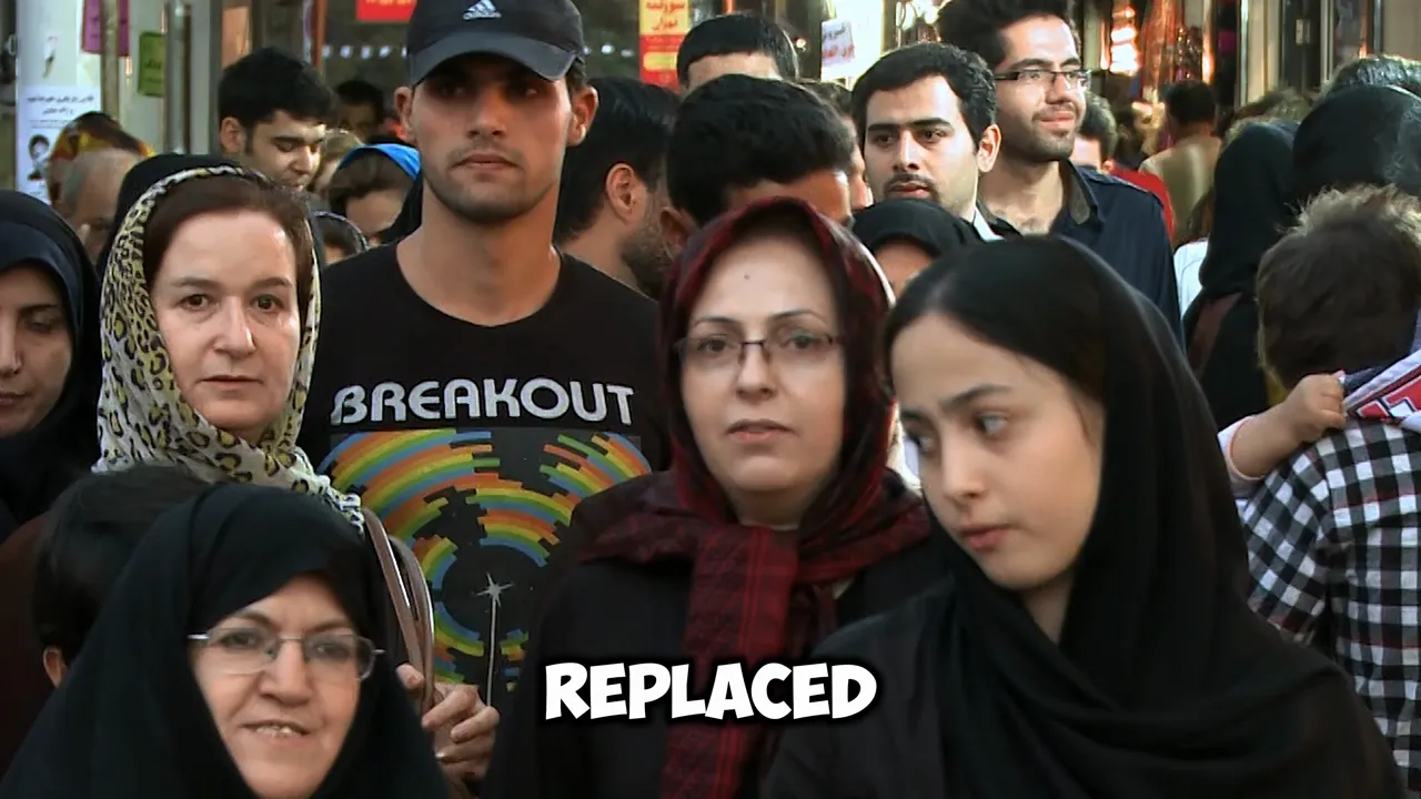 Crowded street or market scene with many pedestrians, including several women wearing headscarves, close-up.