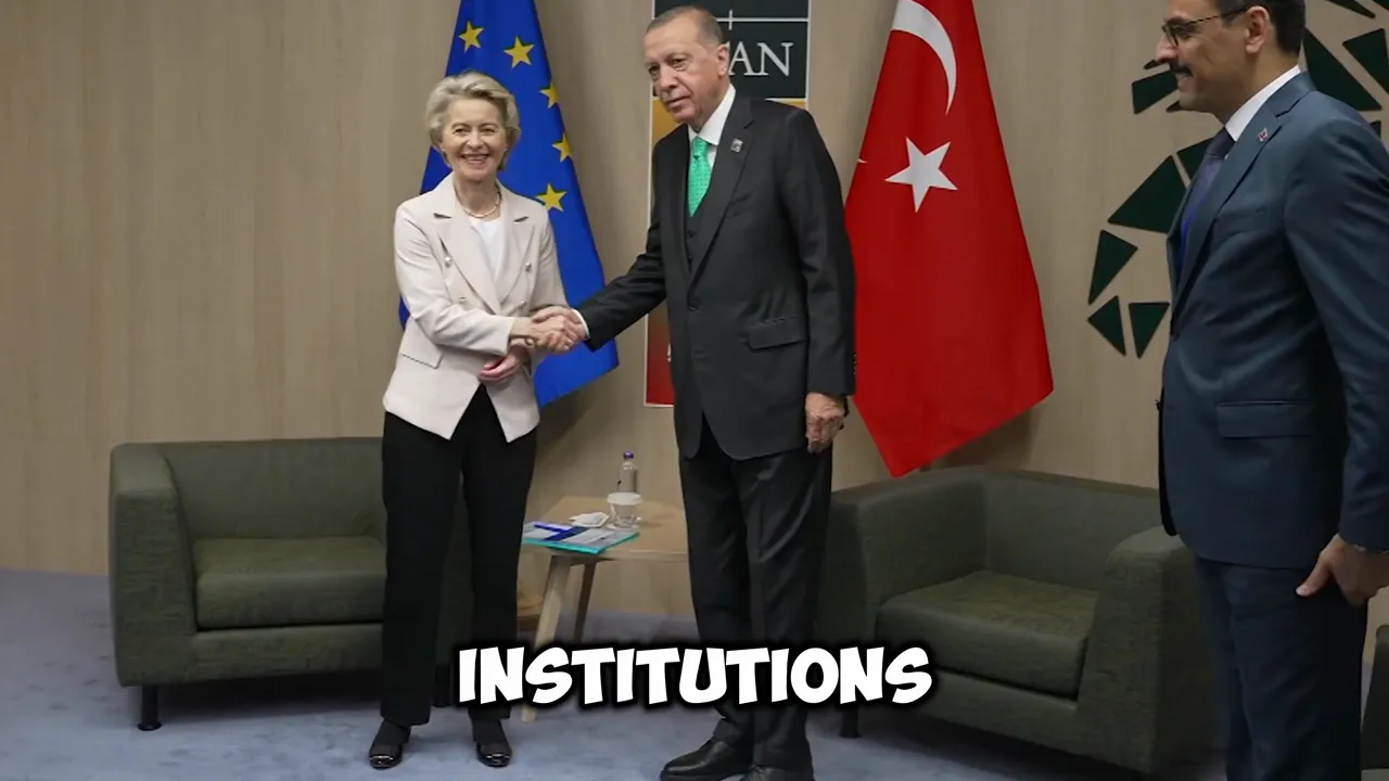 Two officials shaking hands in a meeting room with an EU flag and a national flag visible in the background.