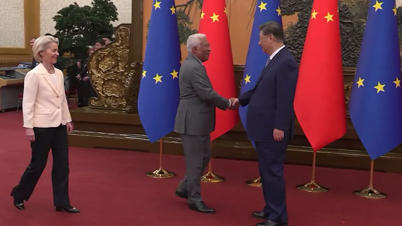 Diplomatic handshake in front of European Union and Chinese flags in a formal hall