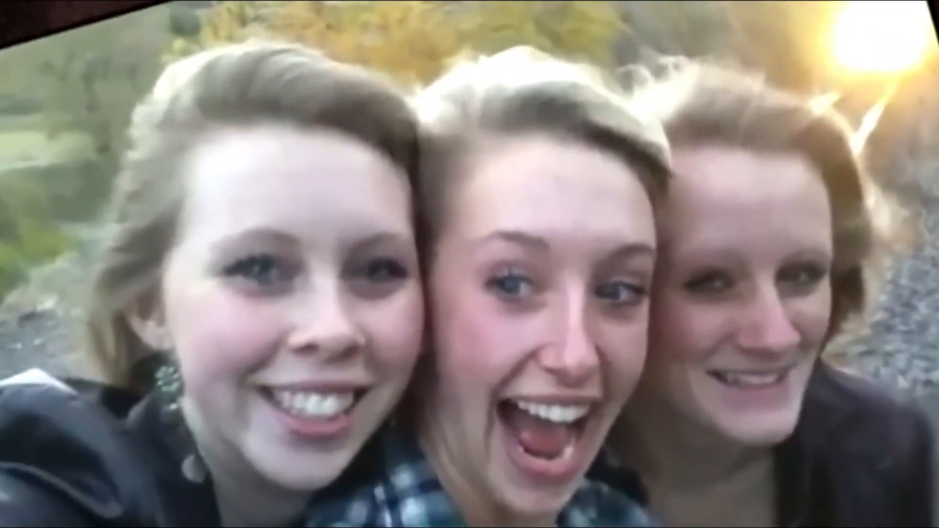 Three teenagers' final photo on train tracks.