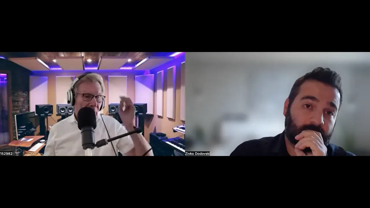 Zoom-style screenshot of a podcast host gesturing into a studio microphone while the guest listens thoughtfully with his hand to his chin.