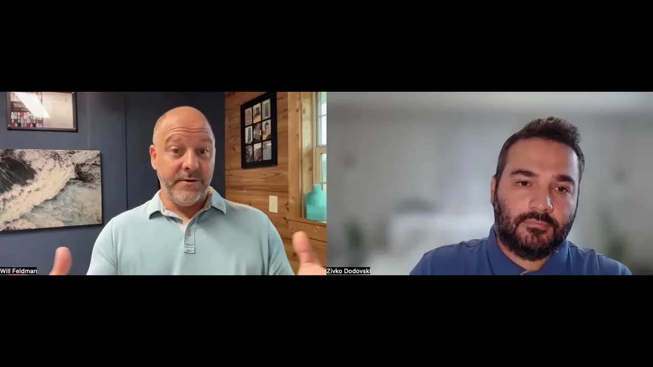 Split‑screen interview with the guest using hand gestures while the host listens; clear, engaging framing.