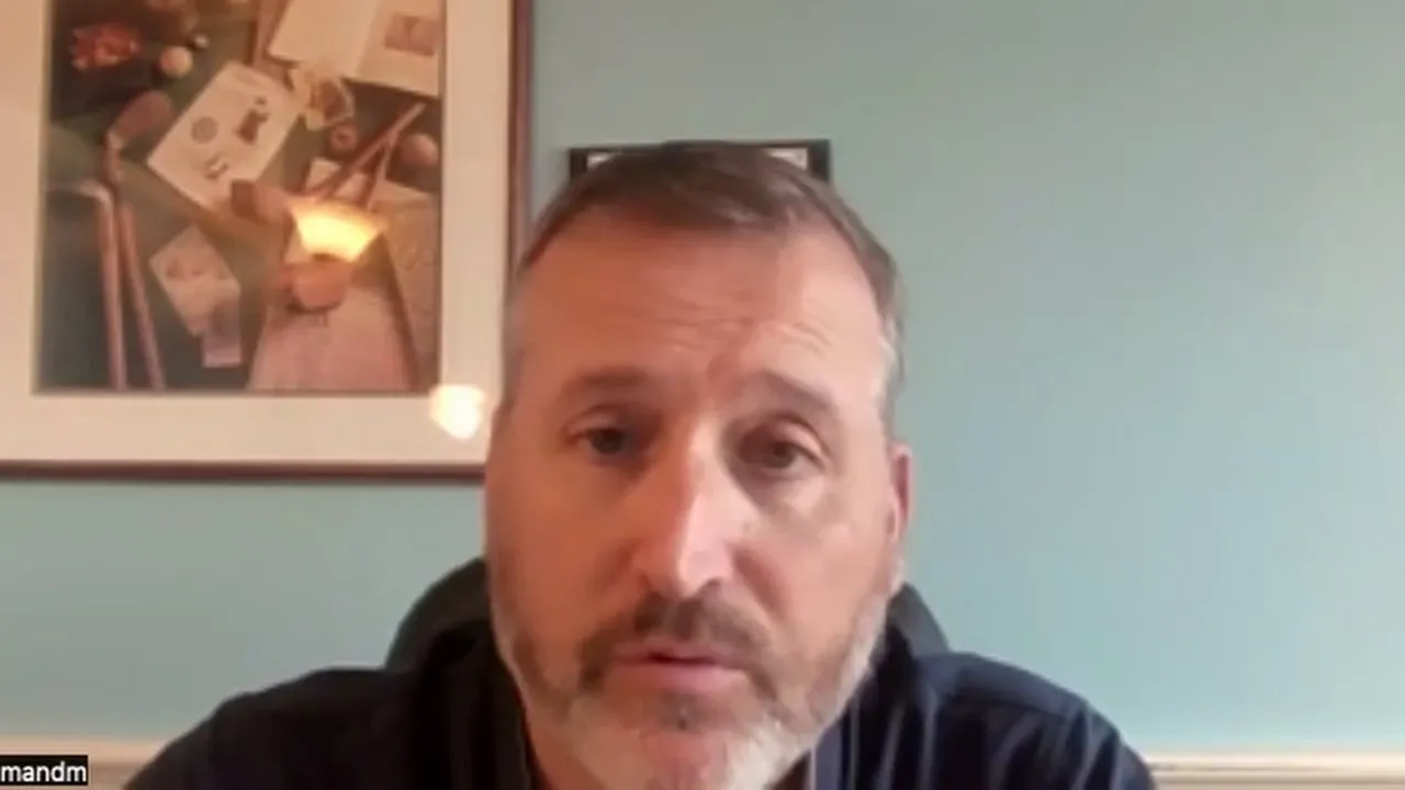 Speaker on a video call discussing traditional merchant account underwriting