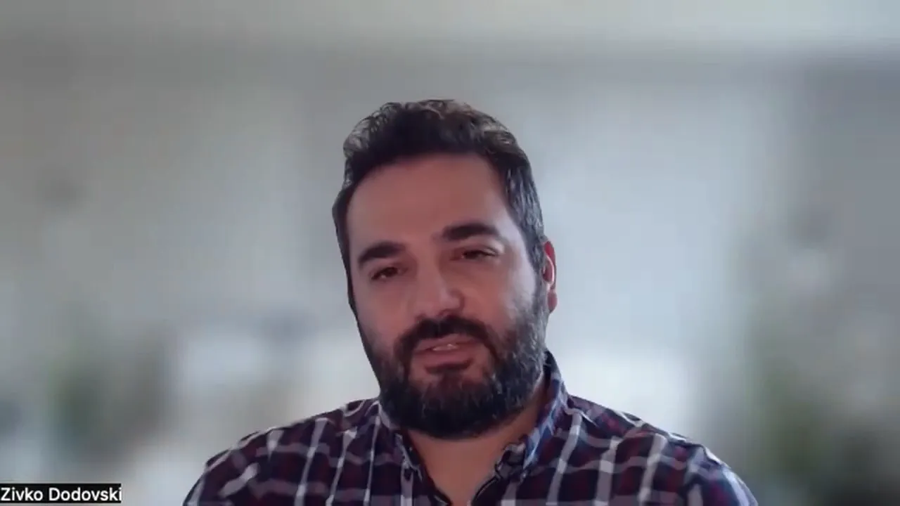 Presenter on a video call explaining international card fees and interchange differences