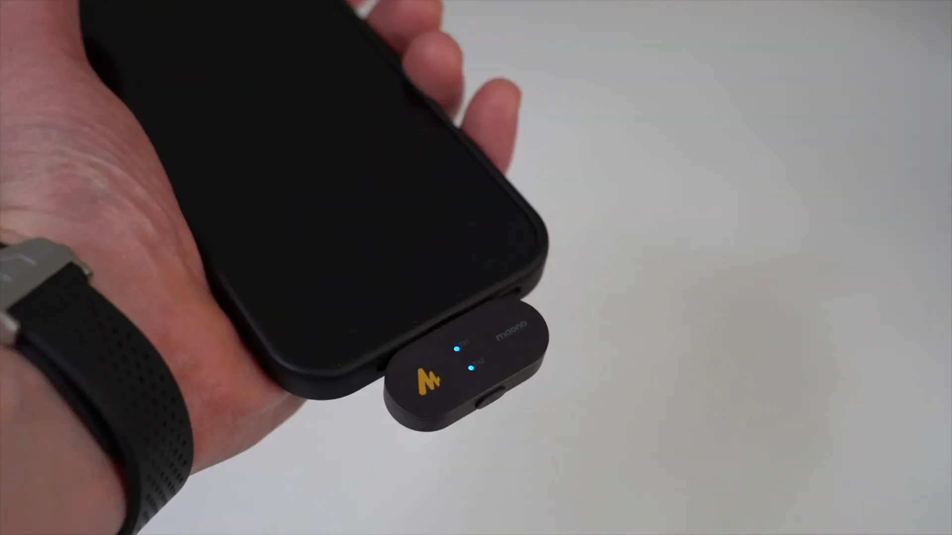 Mobile receiver plugged into smartphone, ready to pair with transmitter