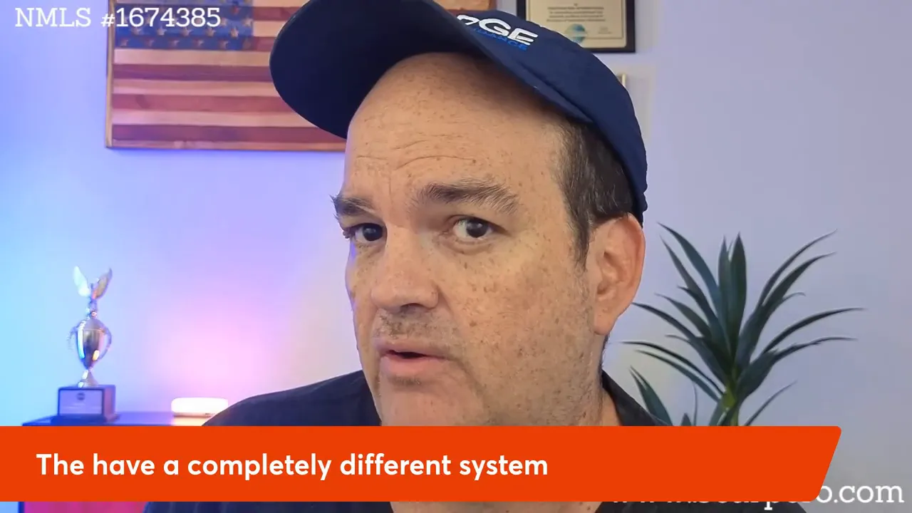 Well-lit presenter looking toward the camera with background flag, plant and a banner reading 'The have a completely different system'.