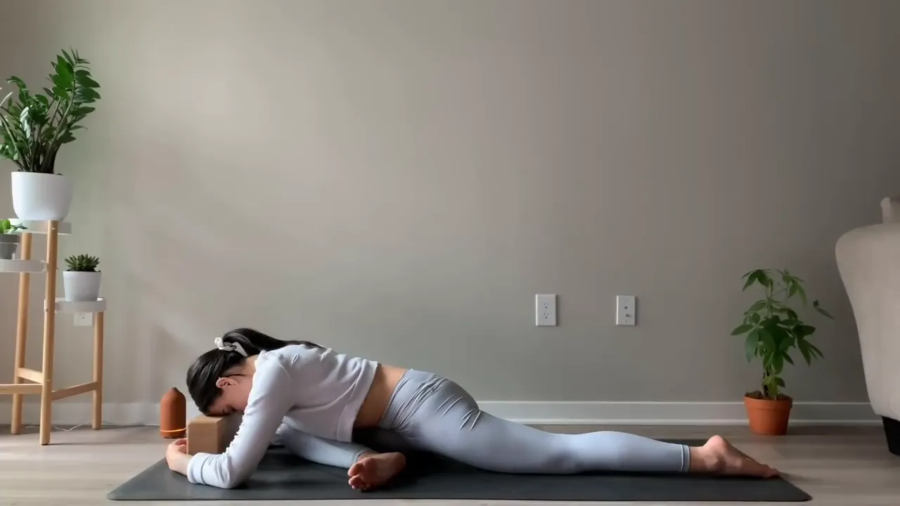 Resting in Pigeon Pose with forehead on the mat