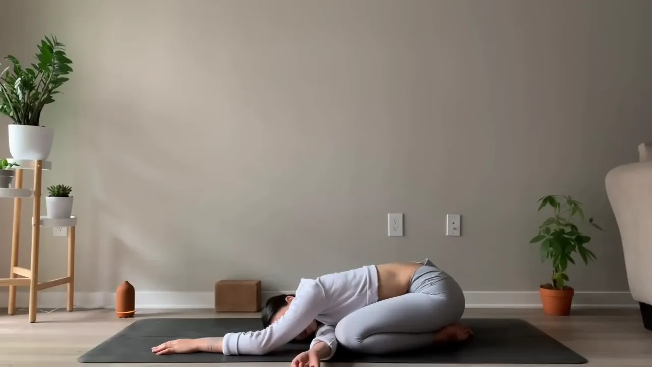 Child's Pose Twist with left arm under right arm