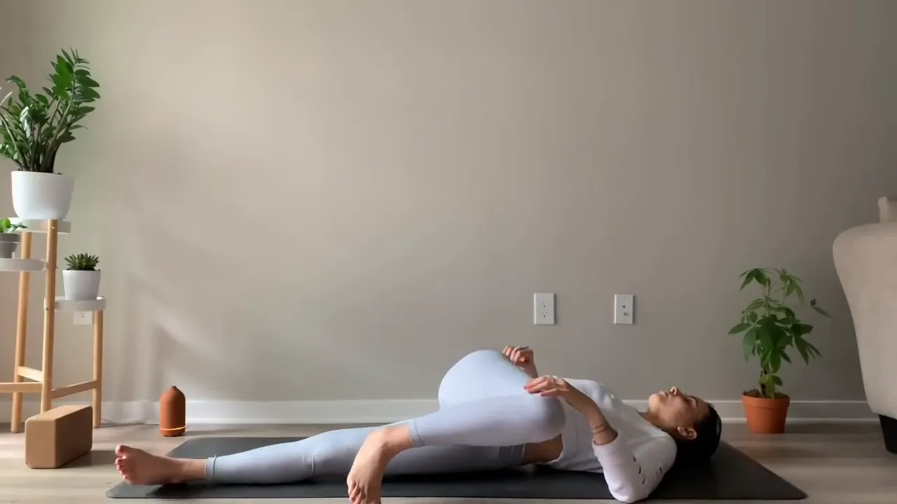 Entering reclining twist with right leg across body