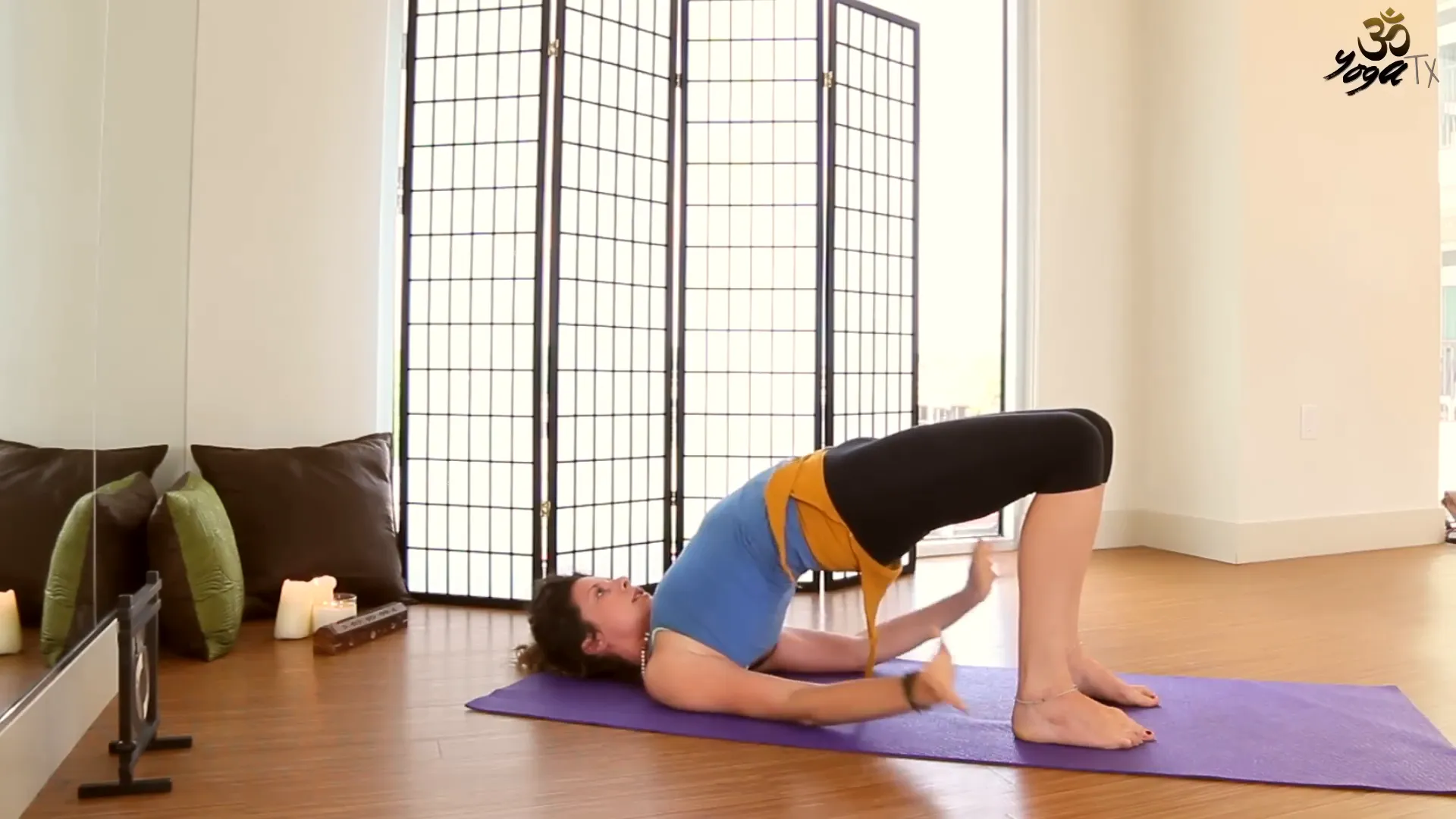 Performing Bridge Pose for lower back relief