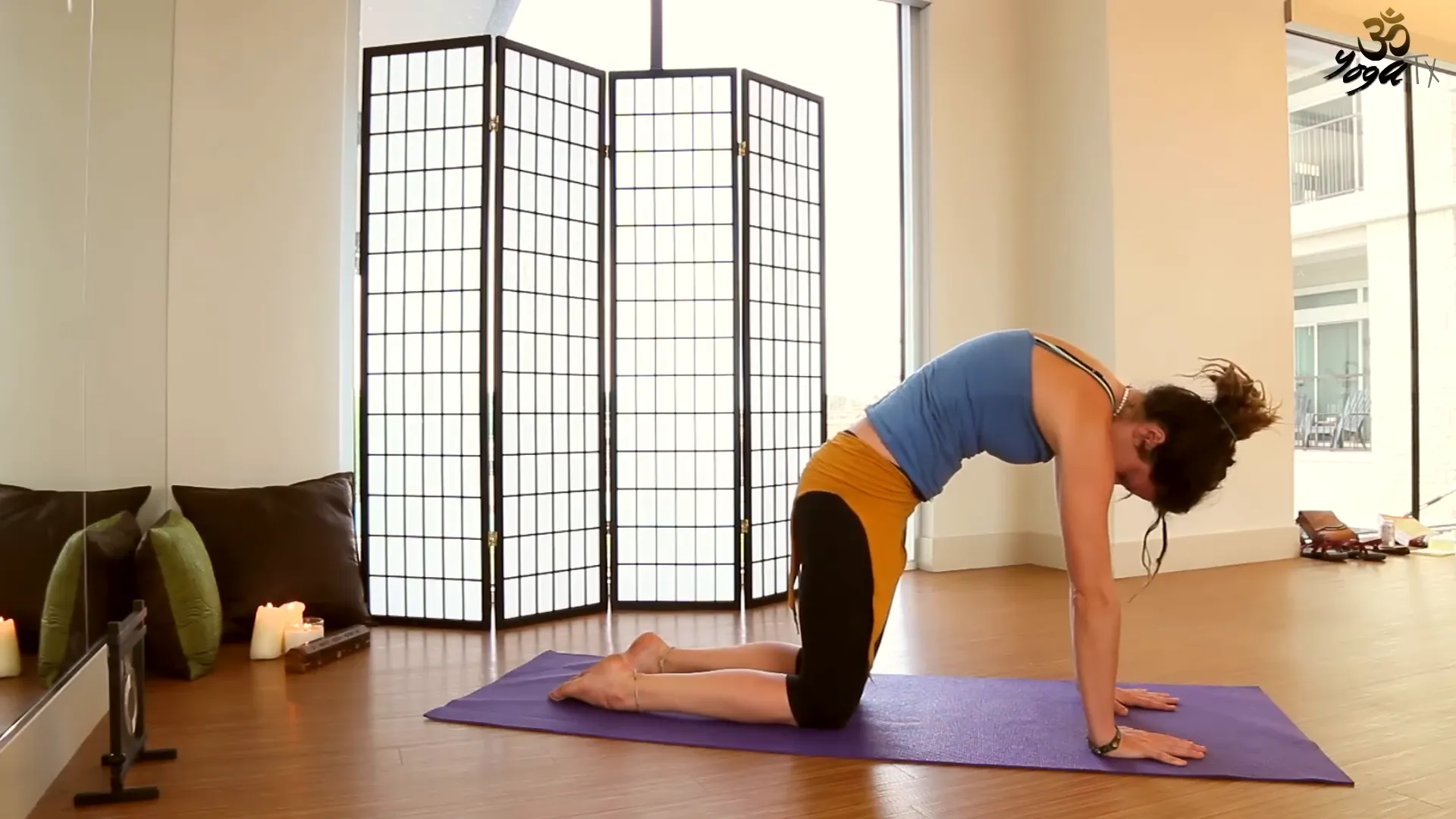 Performing Cat-Cow pose