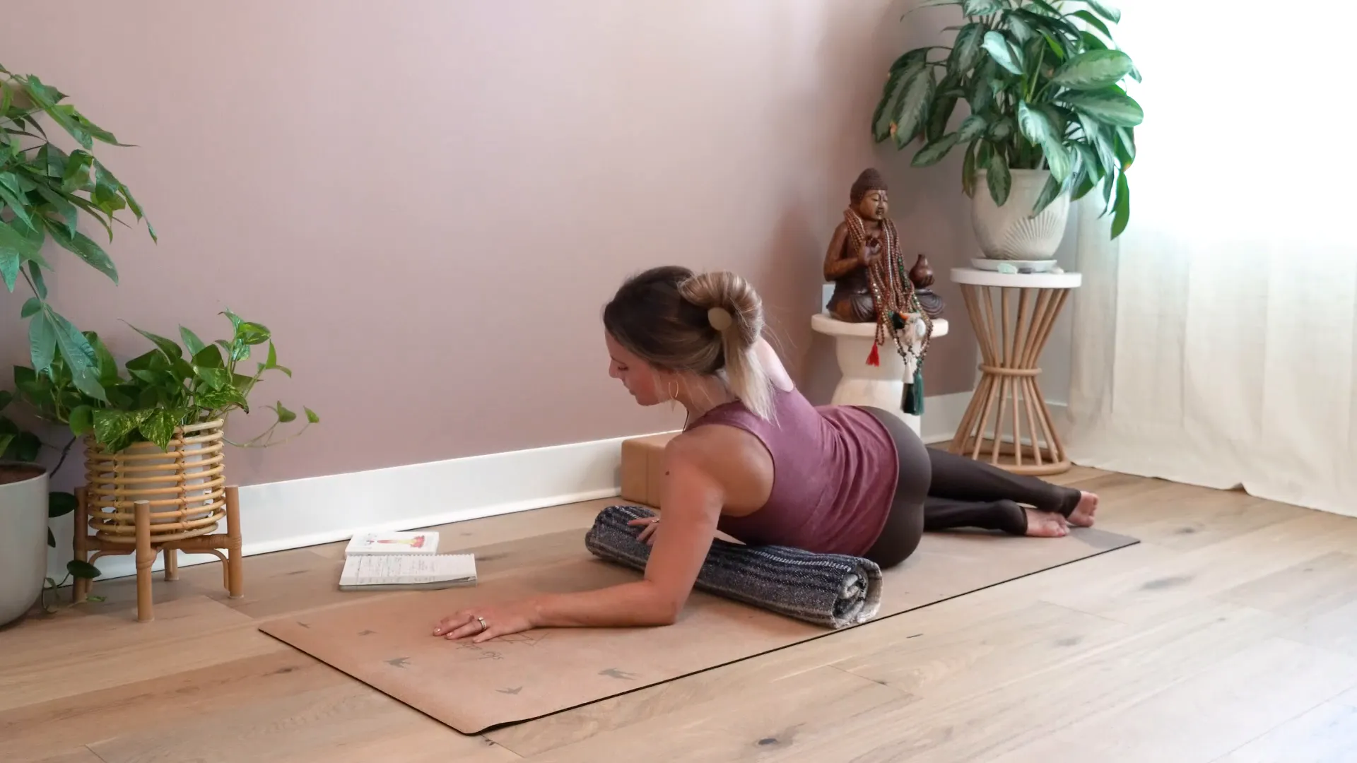 Sphinx pose with bolster support for gentle backbend