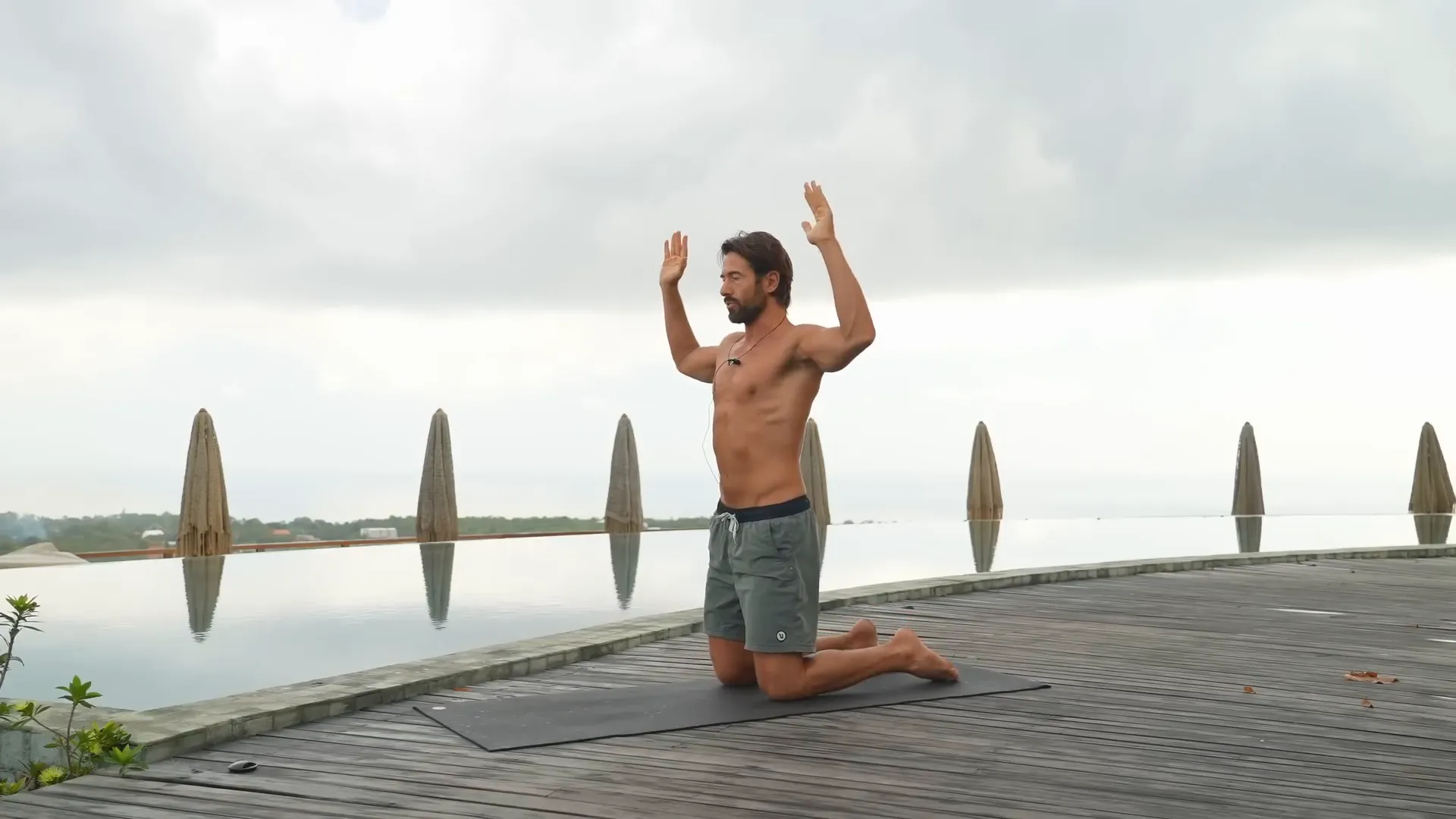 Arms in cactus position squeezing forearms and pressing elbows forward
