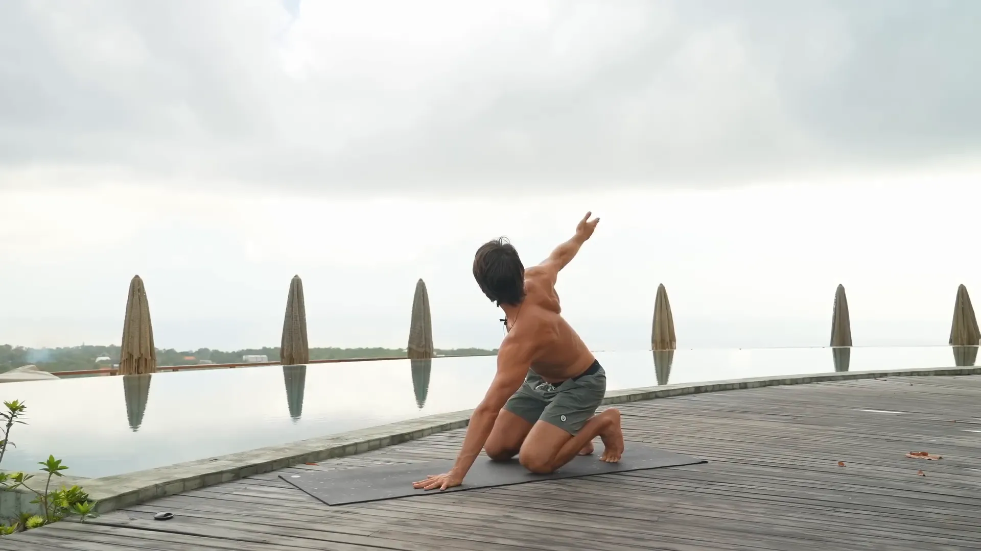 Arm reach and palm rotation to open shoulders