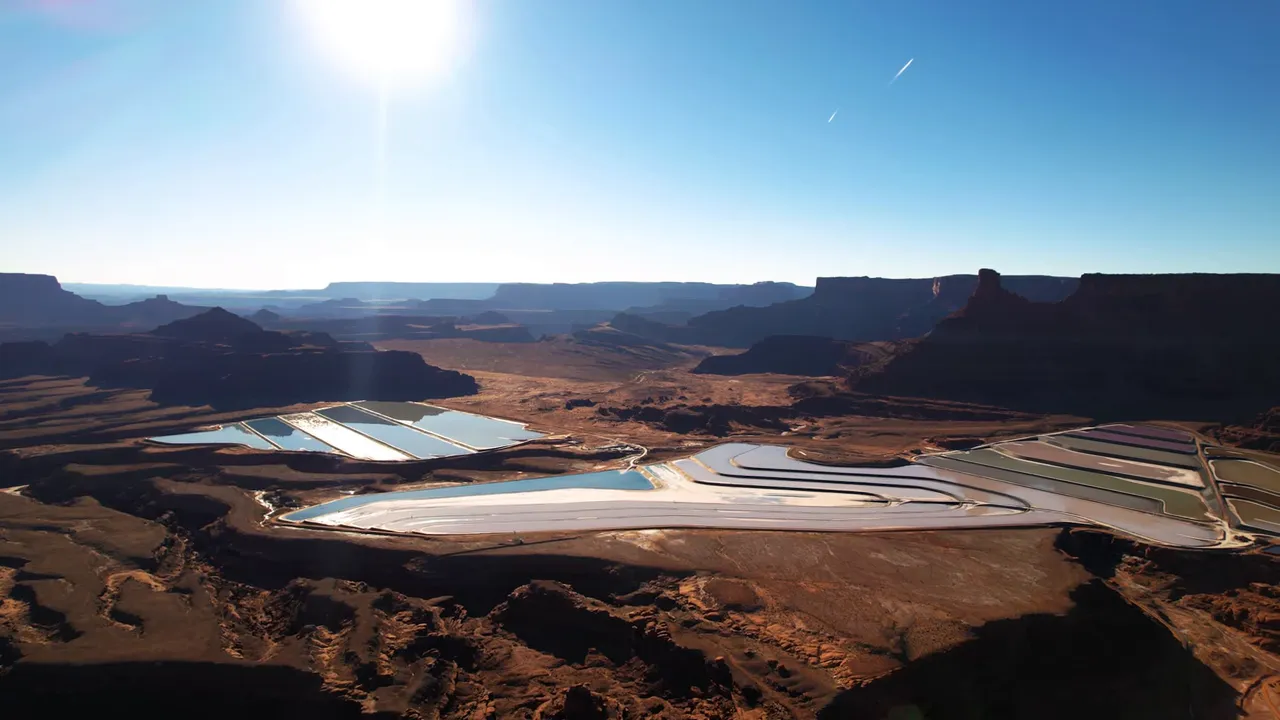 Aerial photo of potash evaporation ponds with canyon landscape near Moab