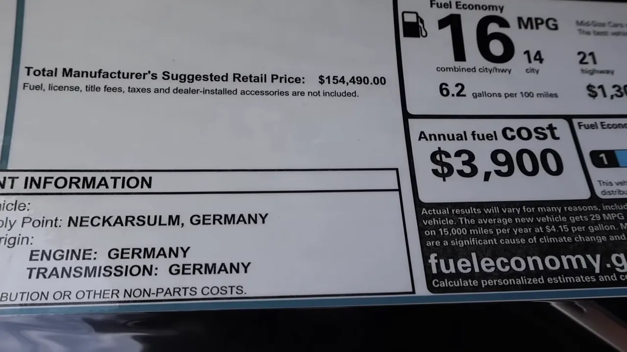 Close-up of the Audi RS7 Monroney label showing Total MSRP $154,490, 16 MPG combined, and content/origin information