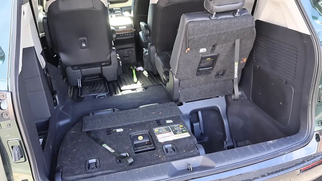 Toyota Sienna rear cargo area with third-row seat folded flat into the floor for extra cargo space
