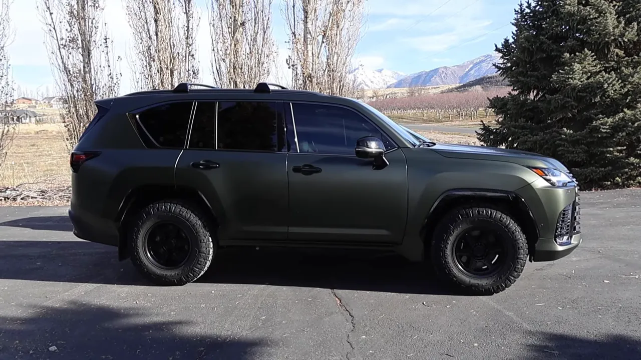 Full side profile of Lexus LX showing long front overhang and bulky front bumper