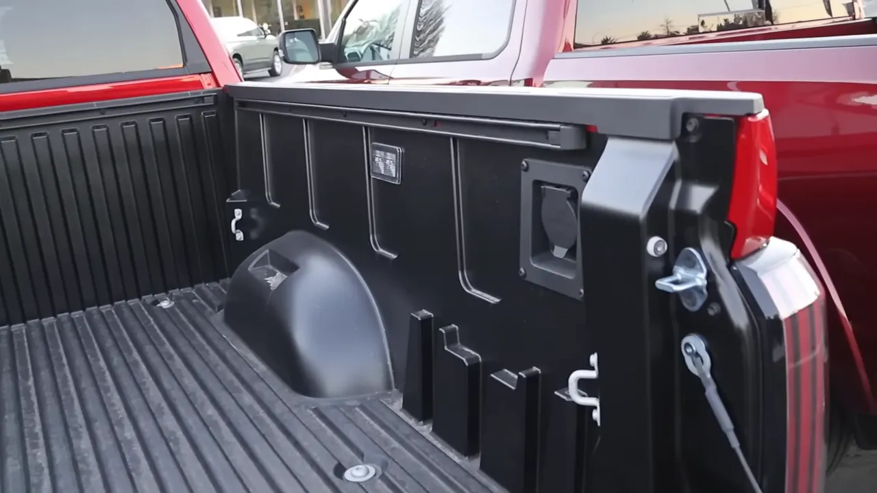 Truck composite bed interior with built-in outlet, LED bed light and tie-downs