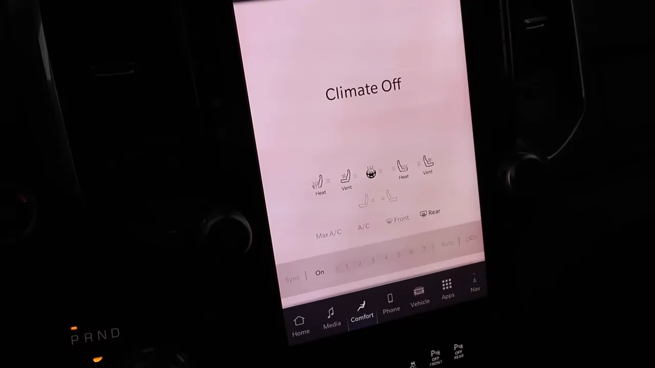 Ram 1500 portrait infotainment screen displaying 'Climate Off' and comfort/menu icons on the center stack