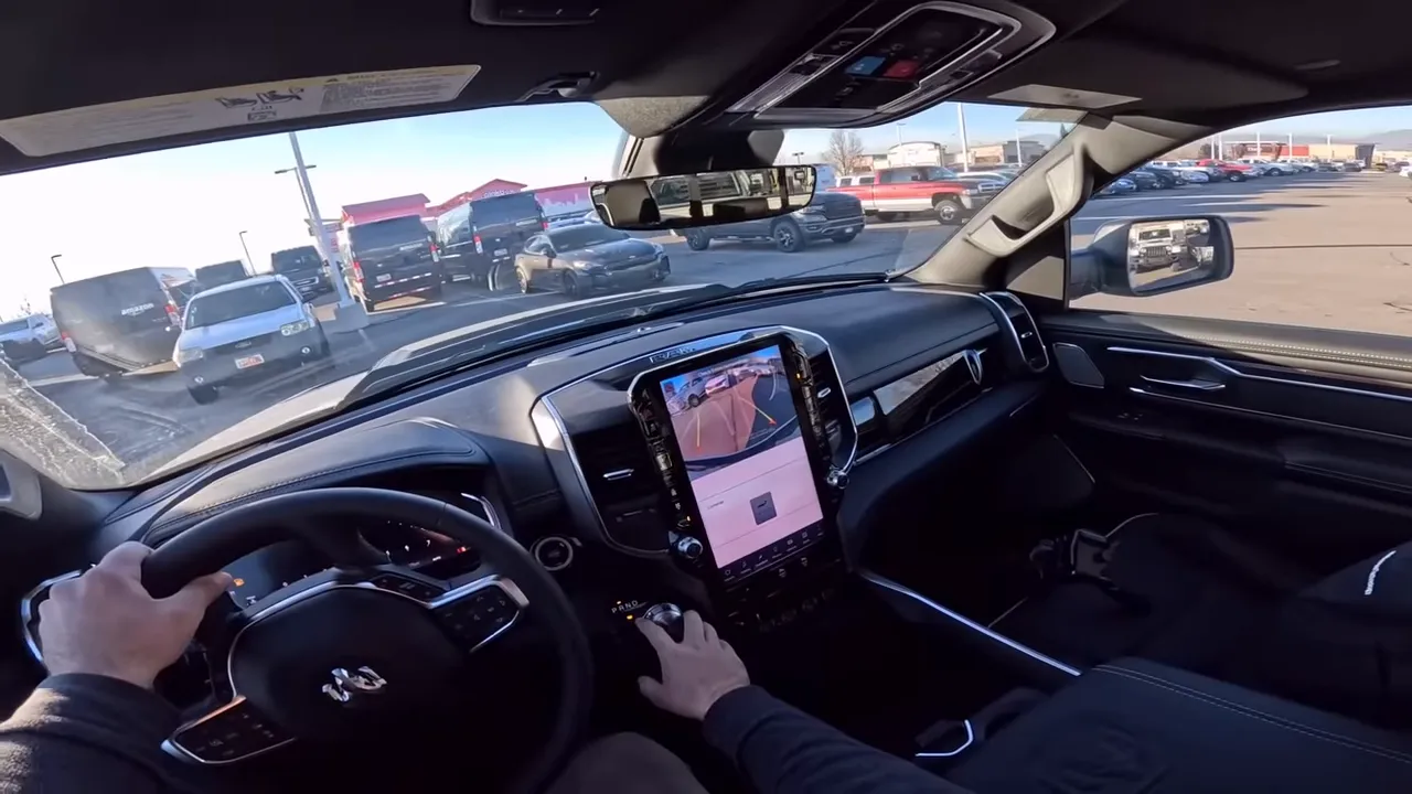 Ram 1500 interior, clear view of steering wheel, center touchscreen and passenger seat