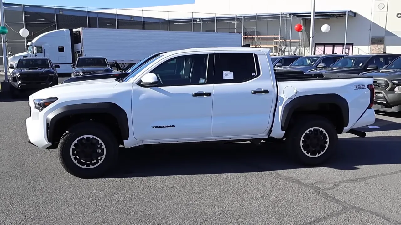 Side profile of a 2026 Toyota Tacoma TRD showing fender flares, taller stance and TRD styling cues.