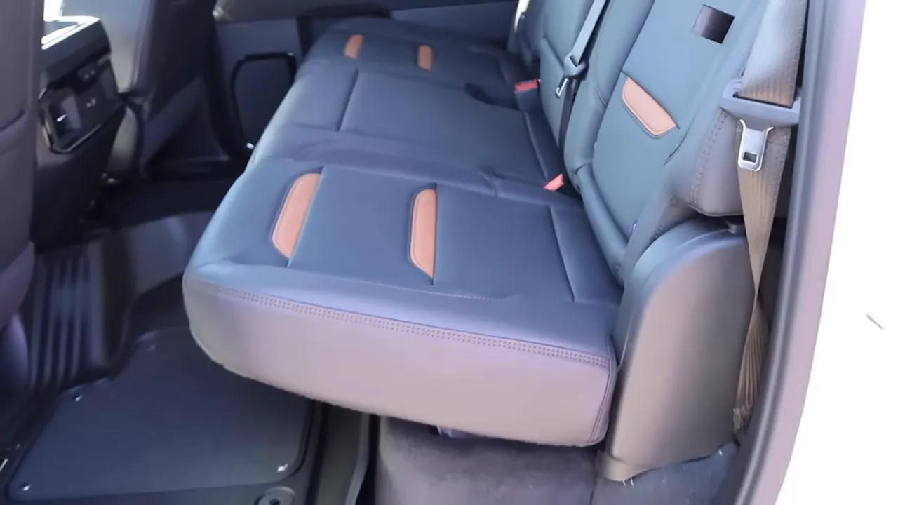 GMC Sierra AT4 rear bench seat with brown accent inserts and seatbelt