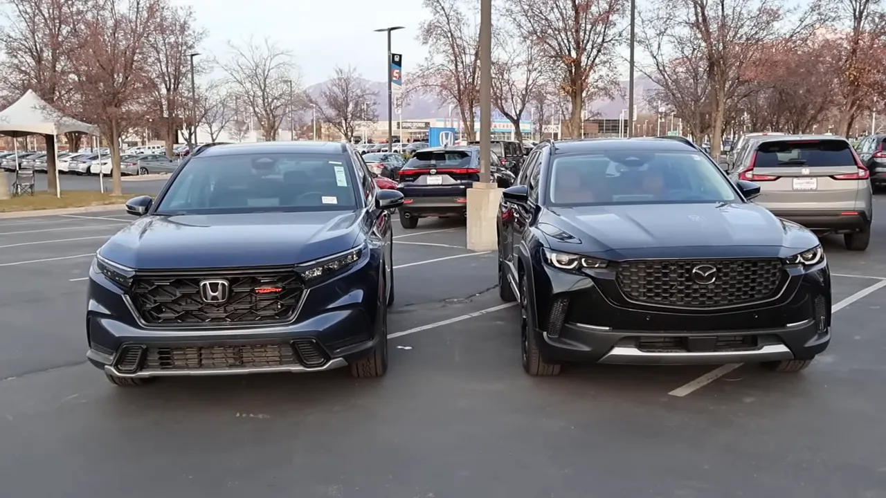 Front view comparison of Honda CR-V TrailSport (left) and Mazda CX-50 Meridian (right)