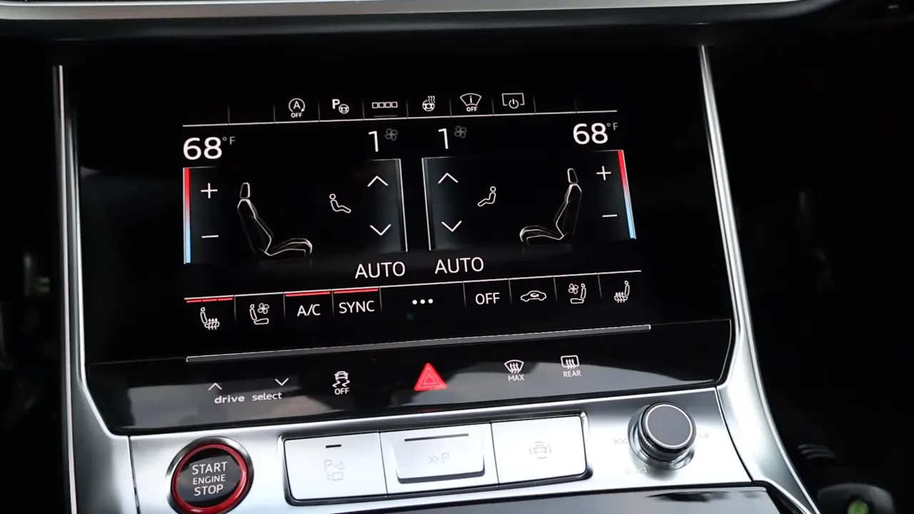 Audi RS6 lower touchscreen climate control display showing dual zone temperatures and seat icons with start engine button visible