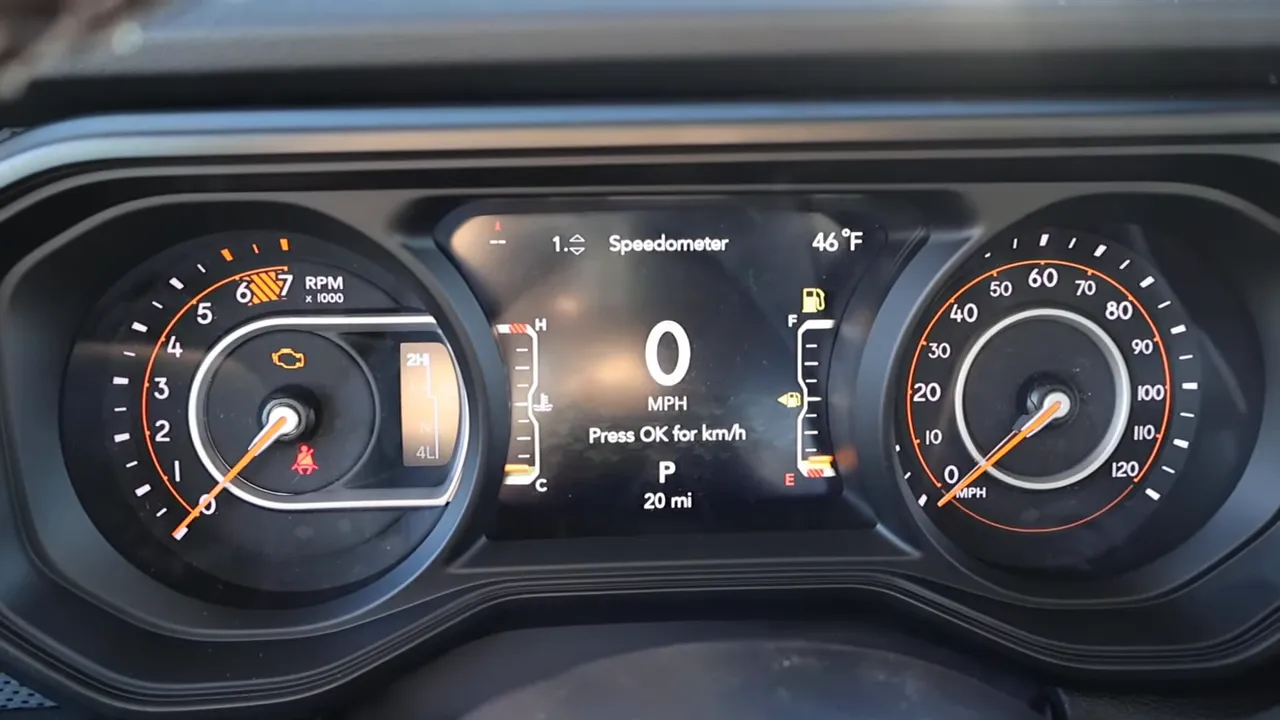 Rubicon instrument cluster showing analog tachometer and speedometer with central digital speed readout
