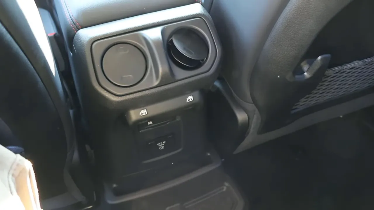 Rear center console cupholder vents and charging ports in 2026 Jeep Wrangler Rubicon X