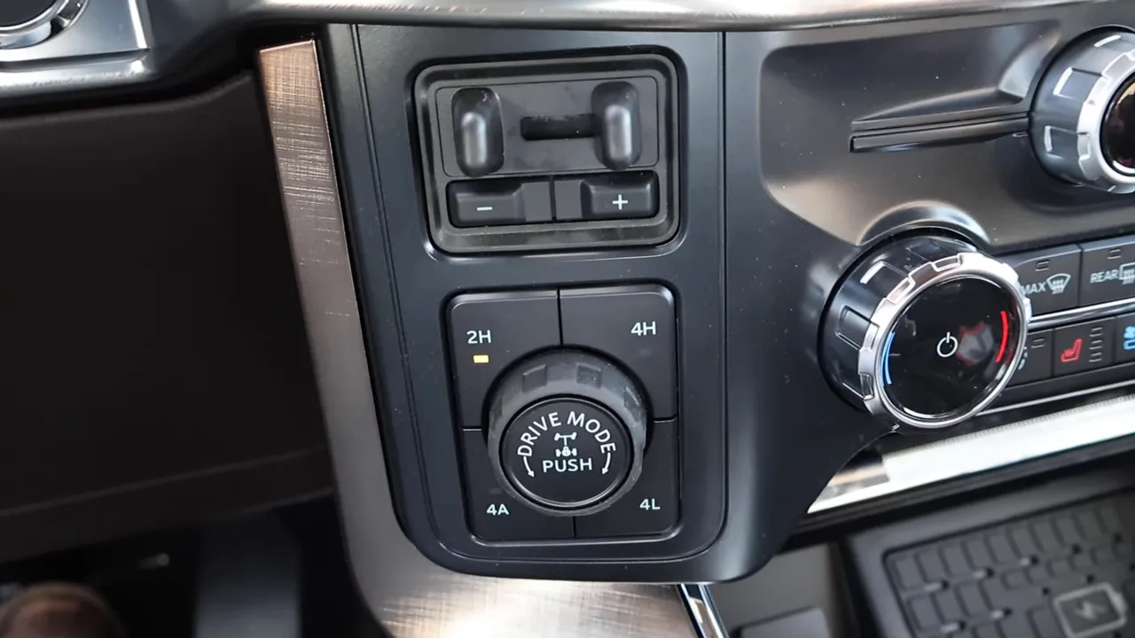 Close-up of drive mode dial and 2H/4A/4H/4L selector in the center console of a 2026 Ford F-150 King Ranch