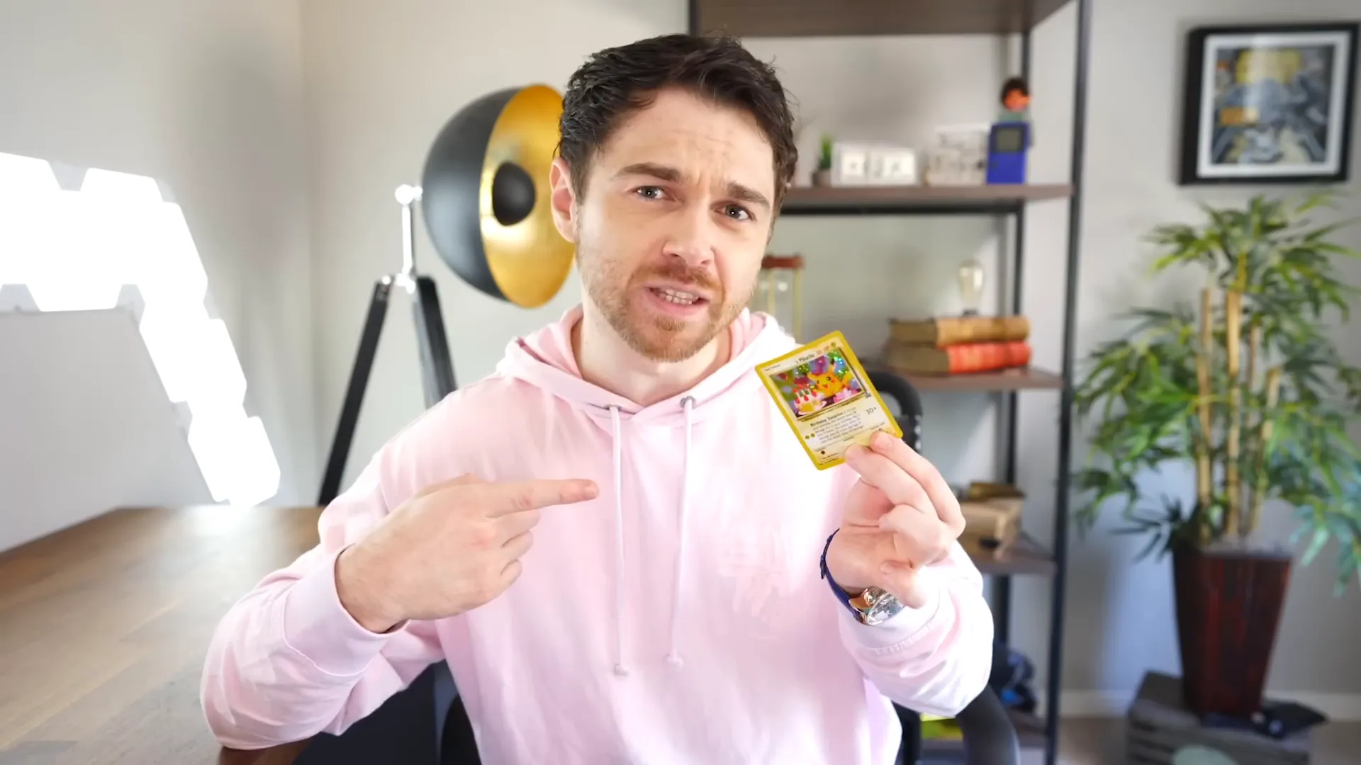 Andrei Jikh explaining life as a video game with a Happy Birthday Pikachu collectible