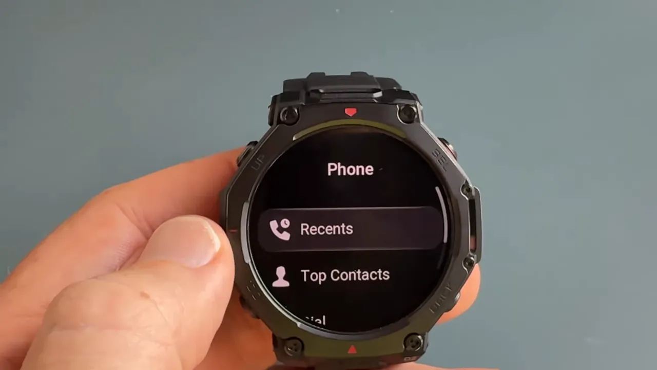 Phone app on watch showing dialer and contacts list