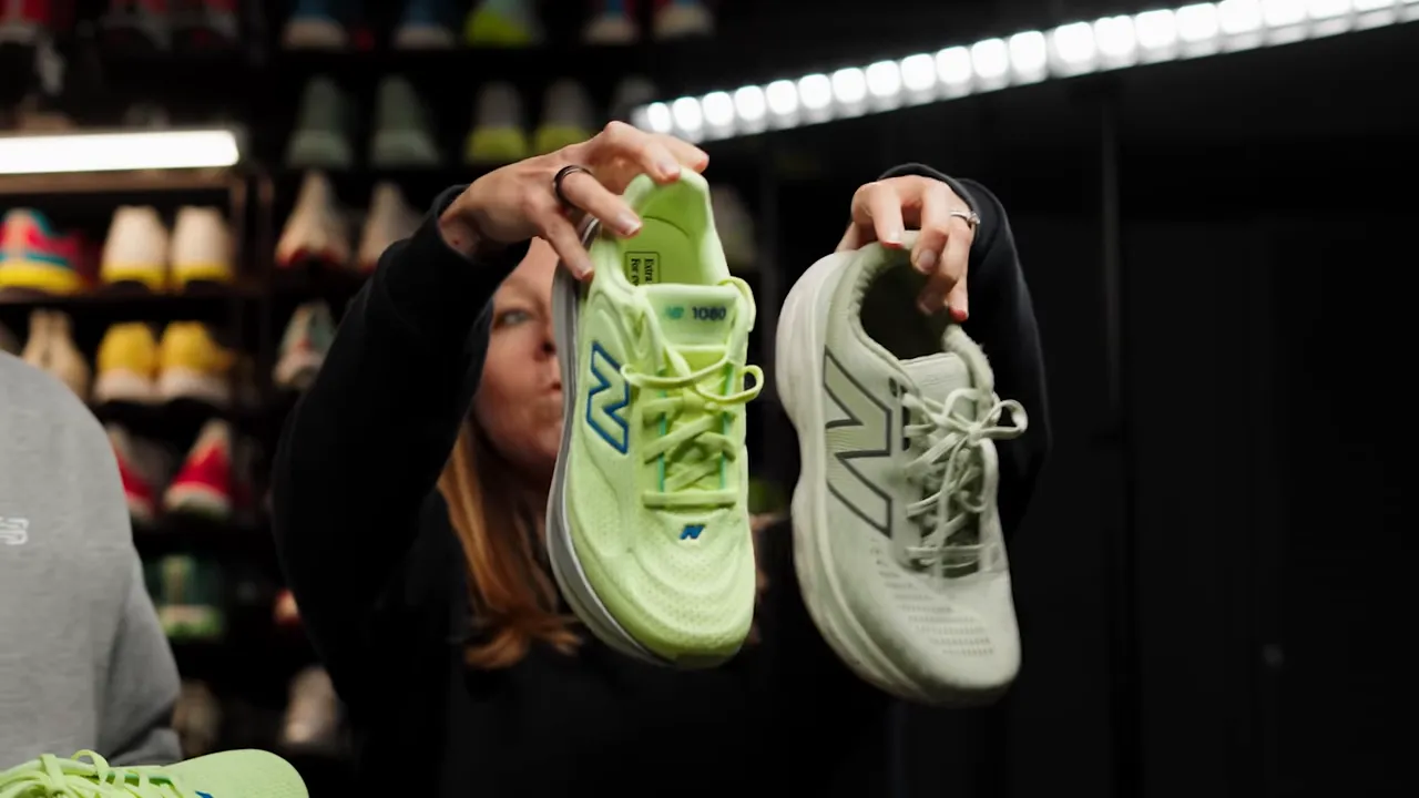 Front view of New Balance 1080 v15 and previous 1080 held up to show toe box and upper silhouette