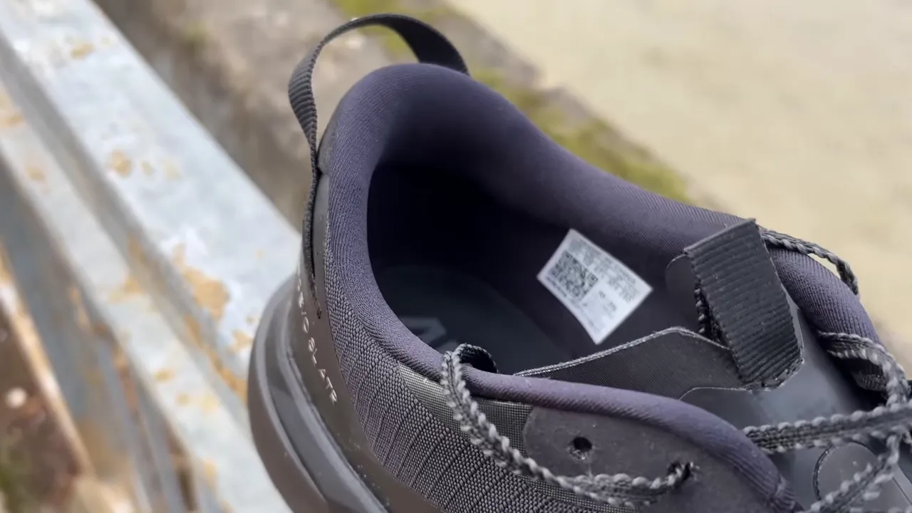 Rear close-up of the Adidas EVO SL ATR showing the padded heel collar, heel pull tab and interior label for assessing fit and entry.