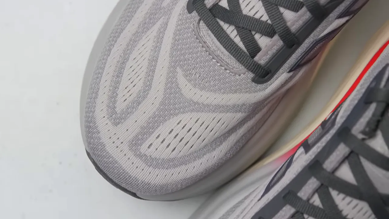 Close up of New Balance Fresh Foam X More v6 toe box, knit upper texture and laces